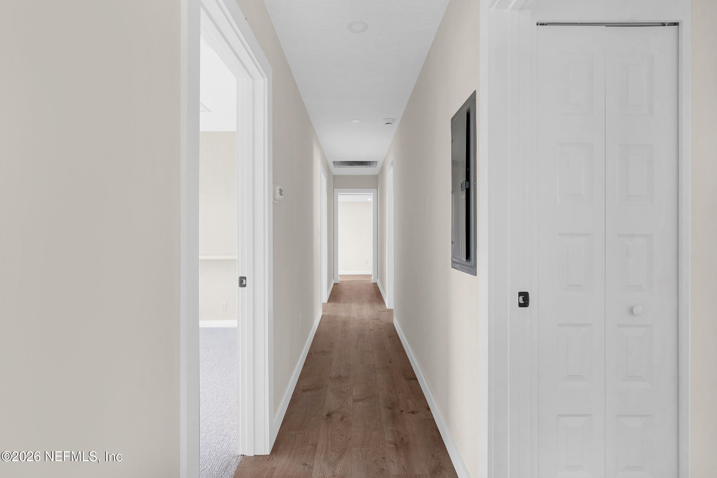 1132 5th Street St. Augustine, FL 32095 - Photo 32 of 34 a view of a hallway with wooden floor and closet