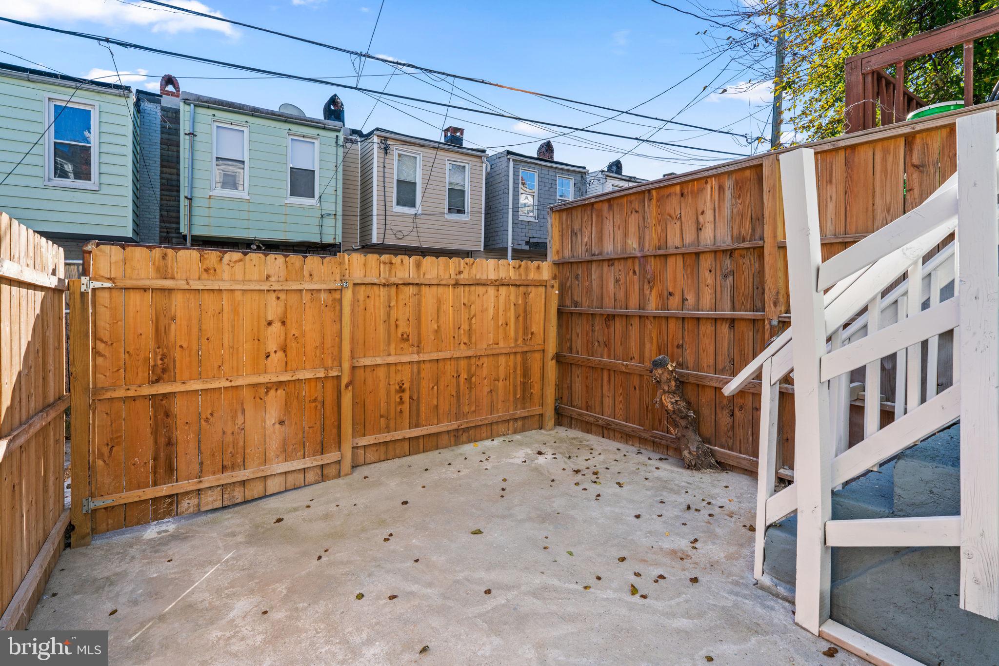 1731 Cliftview Avenue Baltimore, MD 21213 - Photo 30 of 33 a view of a small house with wooden fence