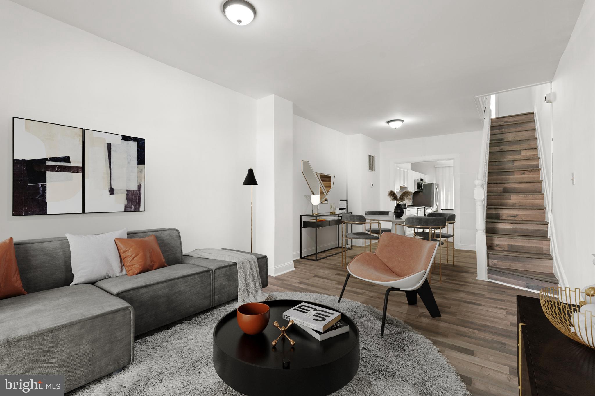 1731 Cliftview Avenue Baltimore, MD 21213 - Photo 3 of 33 a living room with furniture and wooden floor
