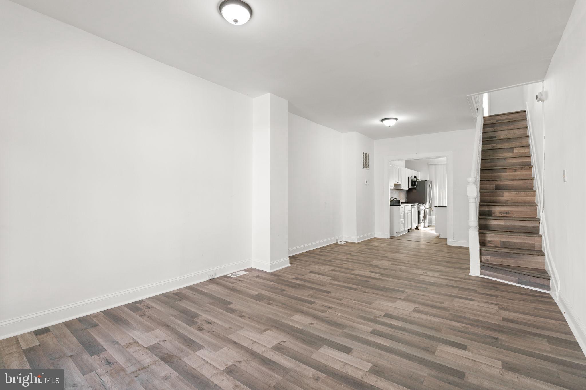 1731 Cliftview Avenue Baltimore, MD 21213 - Photo 4 of 33 a view of empty room with wooden floor