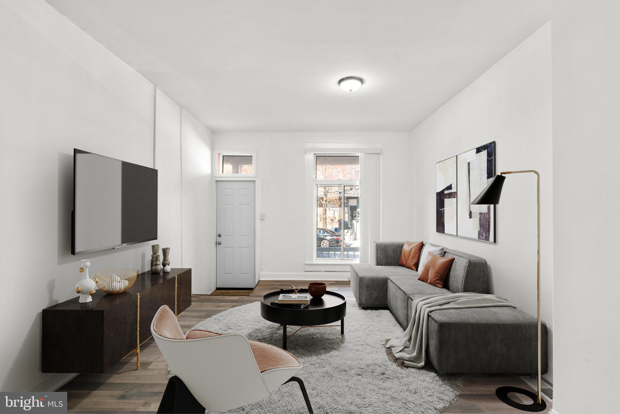 1731 Cliftview Avenue Baltimore, MD 21213 - Photo 5 of 33 a living room with furniture and a flat screen tv