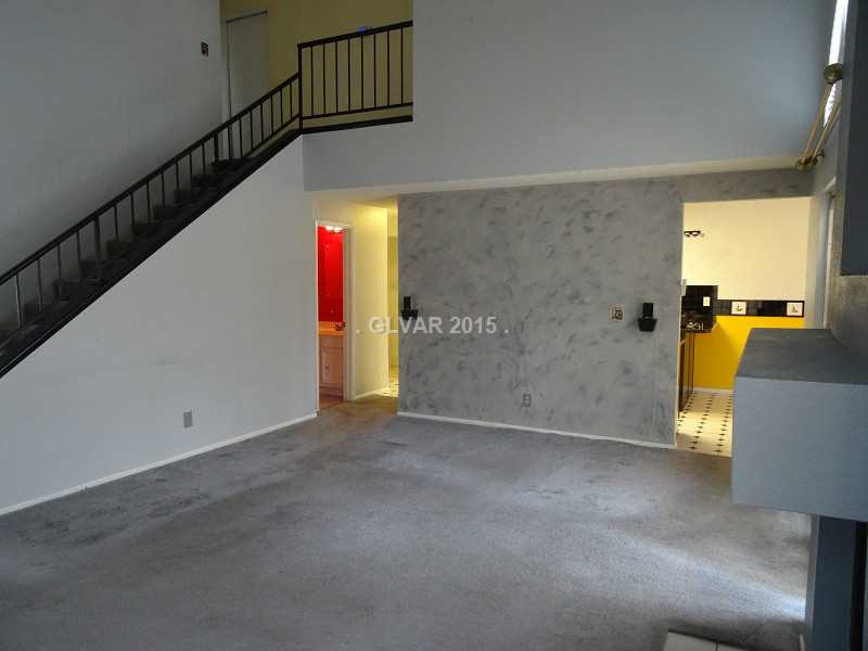 2800 Mirage Road Henderson, NV 89074 - Photo 7 of 35 Living Room. Living Room. View into kitchen, dining room and upstairs. Notice open railing on stairs.