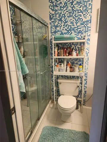 a kitchen with cabinets and appliances