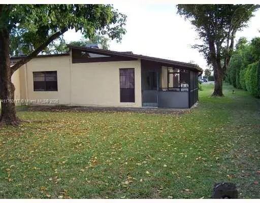 a house with garden in front of it