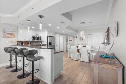 a view of kitchen with furniture and wooden floor