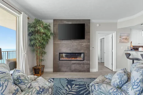 a living room with furniture and a large window