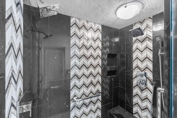 a bathroom with a bathtub sink and mirror