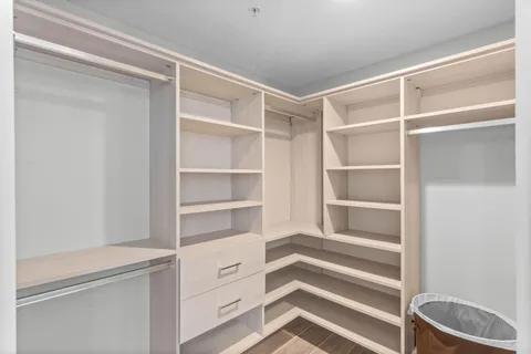 a white toilet sitting next to a small bathroom