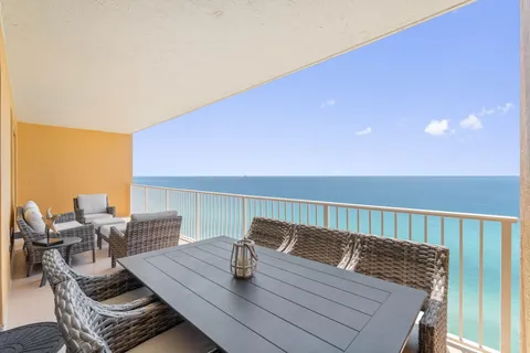 a balcony with an ocean view