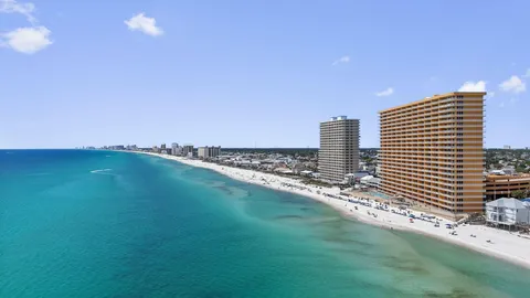 a view of a large building with a field