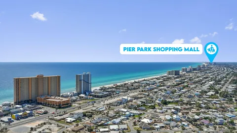 a view of a bench with wooden fence
