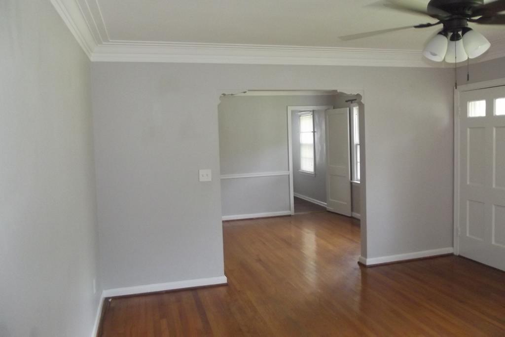 1702 42nd Street Columbus, GA 31904 - Photo 3 of 13 a view of a room with wooden floor and a window