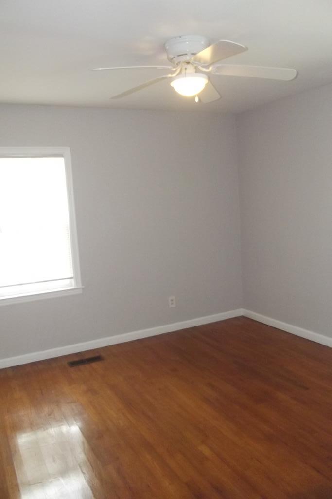 1702 42nd Street Columbus, GA 31904 - Photo 10 of 13 a view of a room with wooden floor and fan