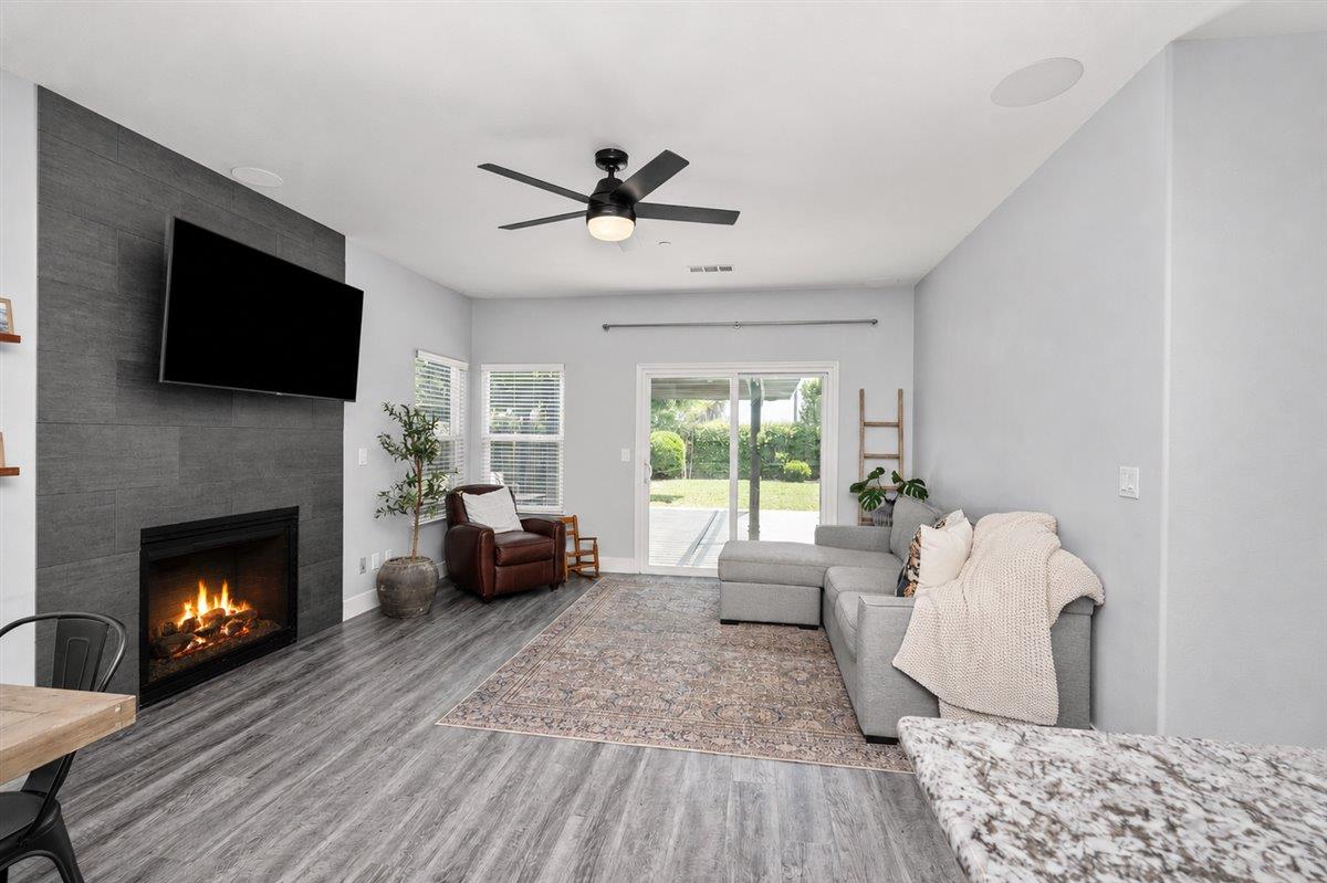 437 Silver Ridge Court Oakdale, CA 95361 - Photo 16 of 41 a living room with furniture and a fireplace