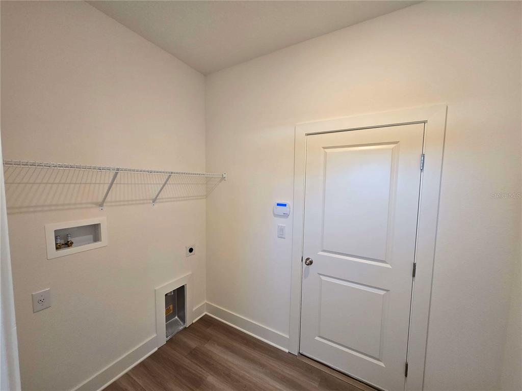 3808 Daybreak Run Loop Spring Hill, FL 34609 - Photo 11 of 14 a view of small space with wooden floor