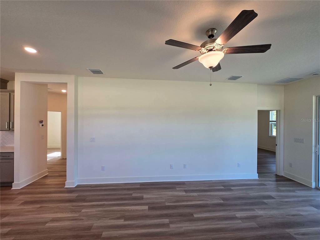 3808 Daybreak Run Loop Spring Hill, FL 34609 - Photo 4 of 14 a view of a room with wooden floor