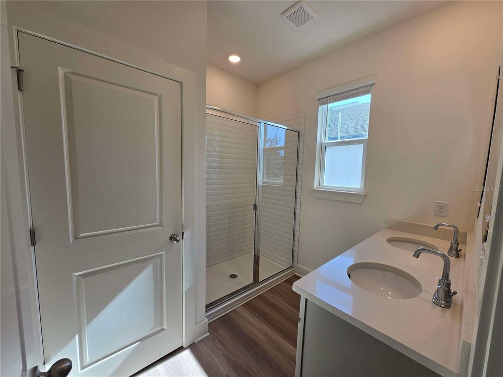 3808 Daybreak Run Loop Spring Hill, FL 34609 - Photo 9 of 14 a bathroom with a sink and mirror