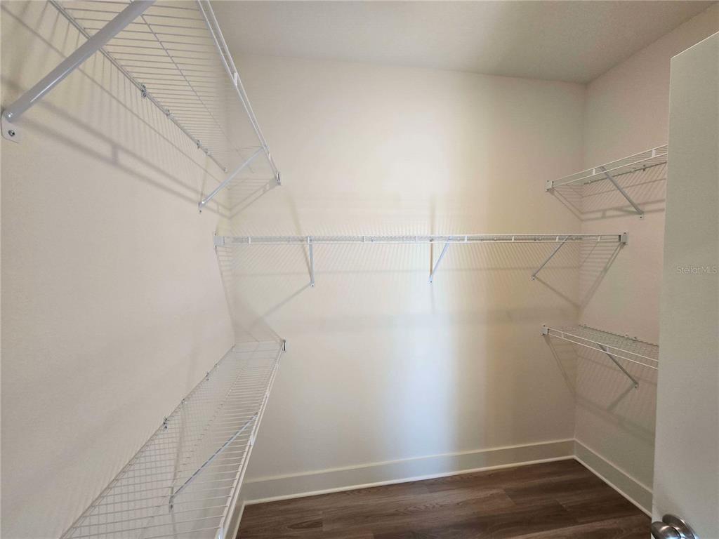 3808 Daybreak Run Loop Spring Hill, FL 34609 - Photo 10 of 14 a view of a room with wooden floor