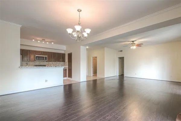 a kitchen with stainless steel appliances granite countertop a stove and a refrigerator