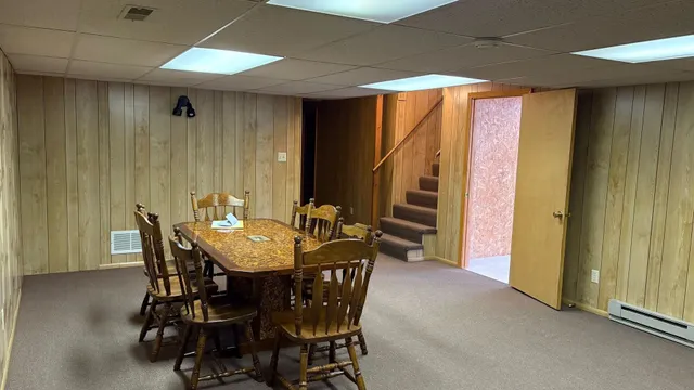 a view of a dining room with furniture and window