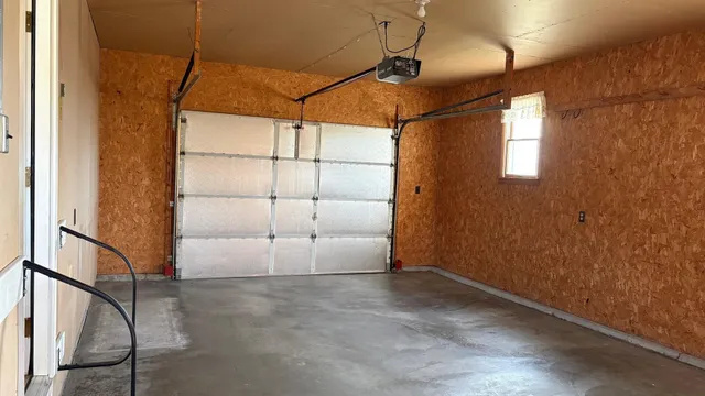a view of an empty room with a garage