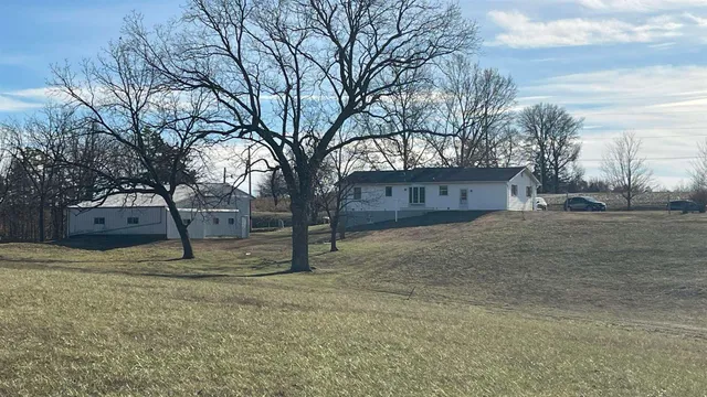 a house with trees in front of it