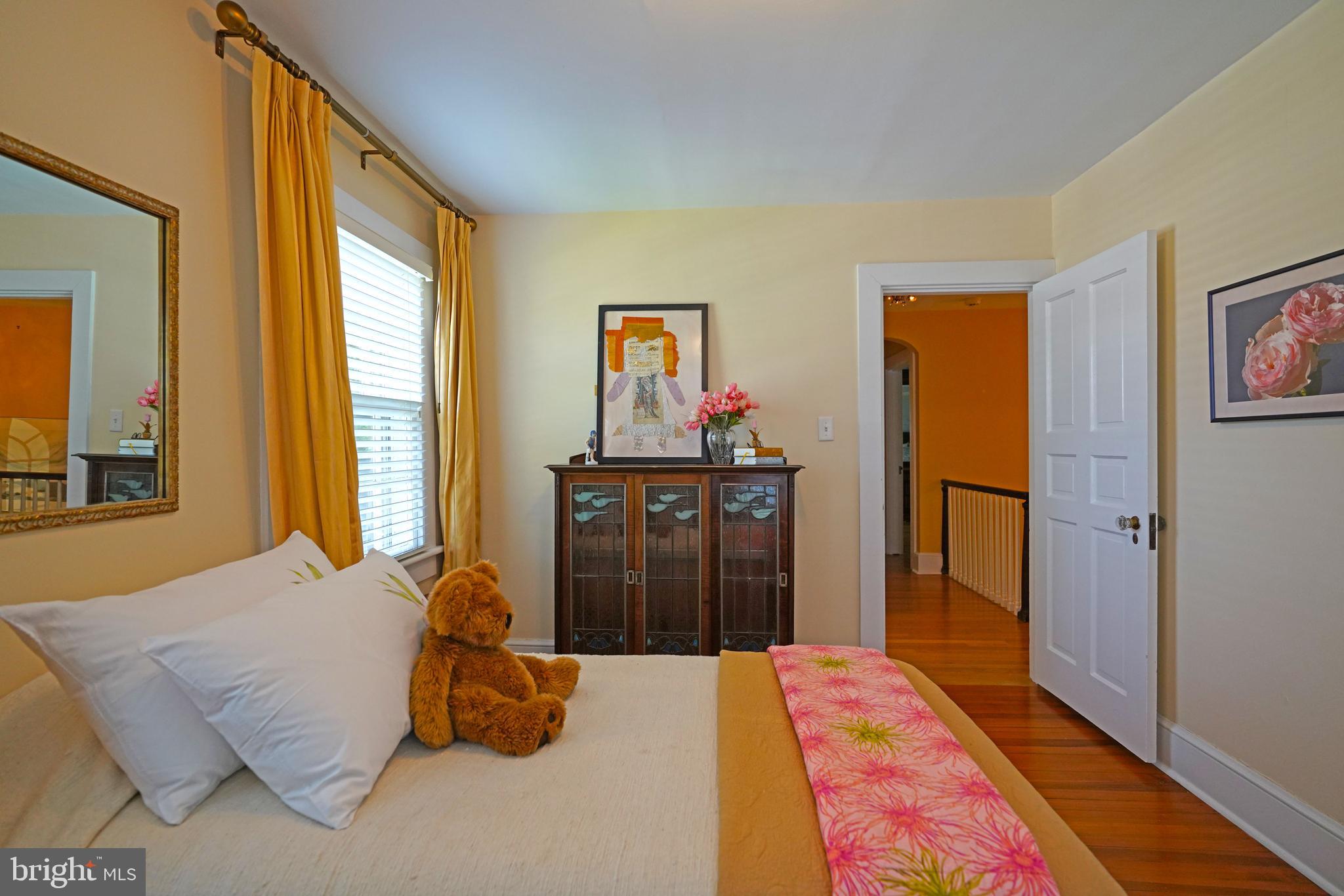240 2nd Street Lewes, DE 19958 - Photo 62 of 90 a bedroom with a bed and a painting on the wall