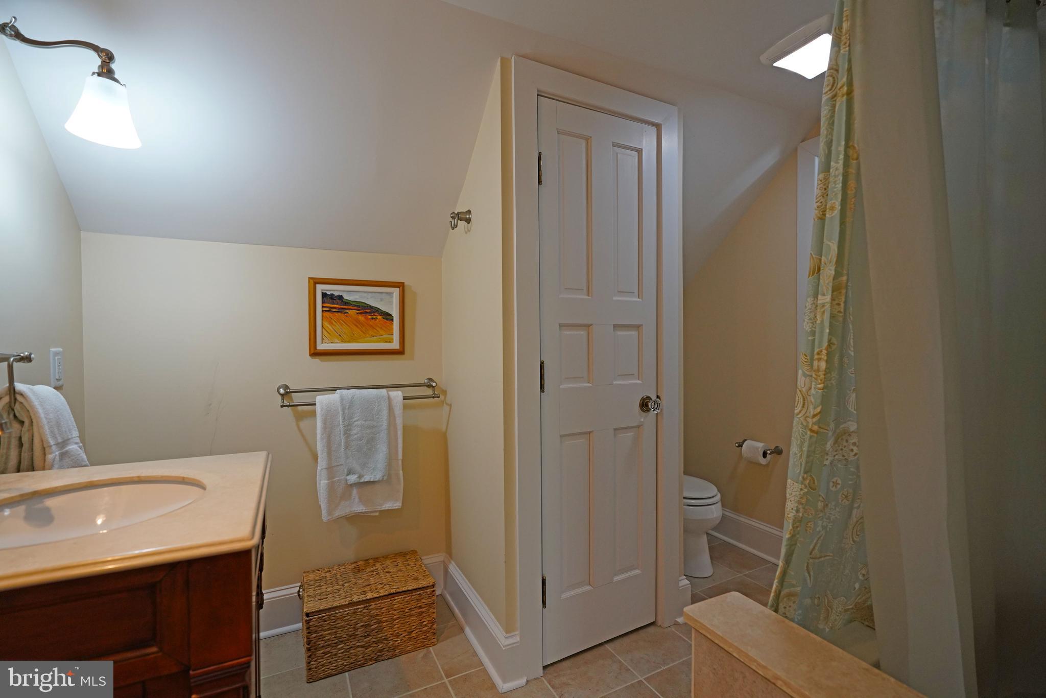 240 2nd Street Lewes, DE 19958 - Photo 69 of 90 a bathroom with a sink and a mirror