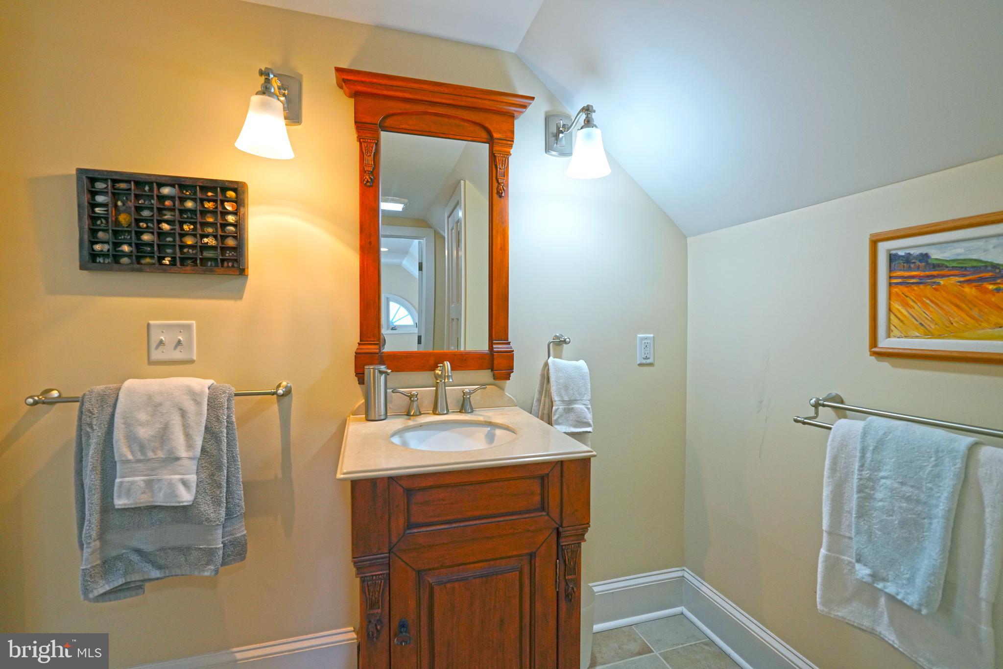 240 2nd Street Lewes, DE 19958 - Photo 71 of 90 a bathroom with a sink and a mirror
