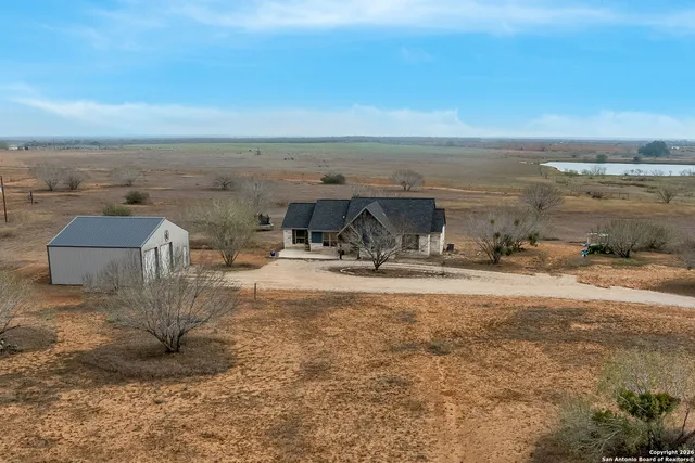 a view of a lake with a yard