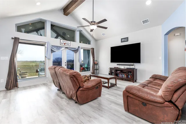 a kitchen with kitchen island a counter top space a sink stainless steel appliances and cabinets
