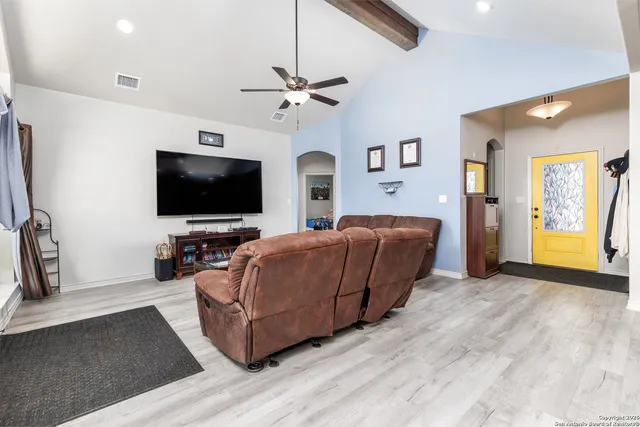 a kitchen with stainless steel appliances granite countertop a kitchen island a stove and a sink