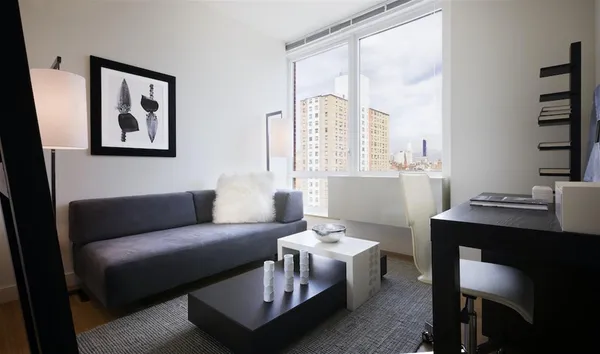 a living room with furniture and a large window