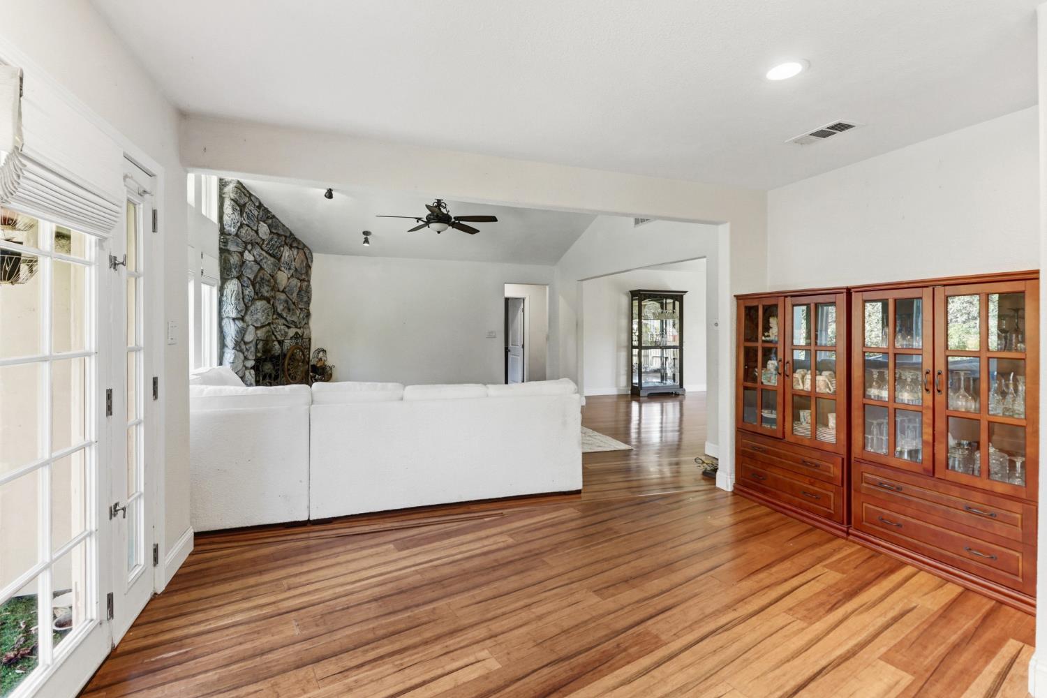 4330 Cavitt Stallman Road Granite Bay, CA 95746 - Photo 11 of 85 a view of an empty room with wooden floor and a window