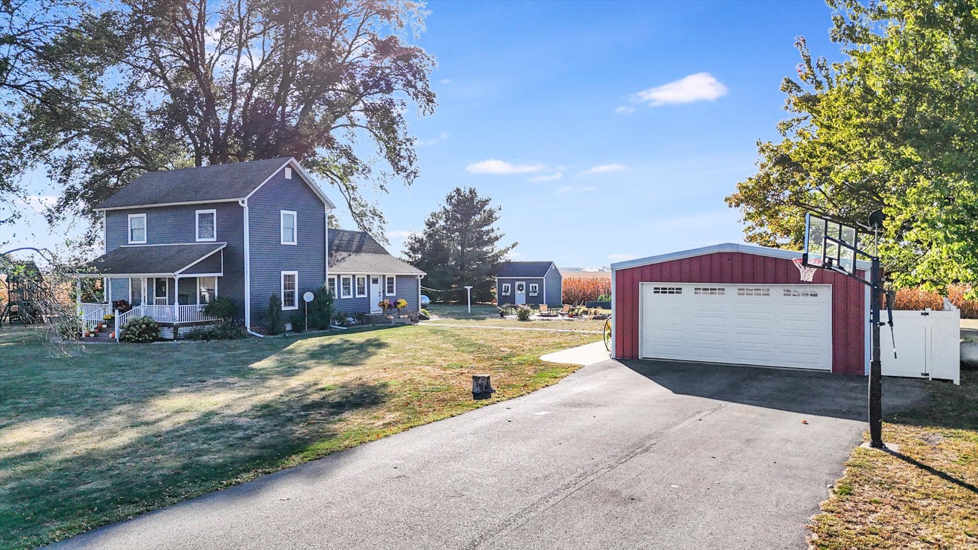 151 County 1700 Road East Villa Grove, IL 61956 - Photo 12 of 76 a view of a house with a yard next to a yard