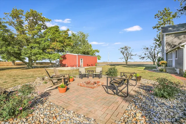 a balcony with furniture and a potted plant