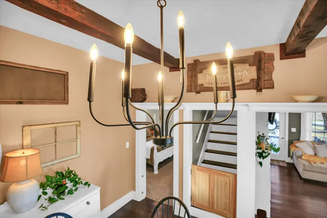 a view of an entryway with wooden floor