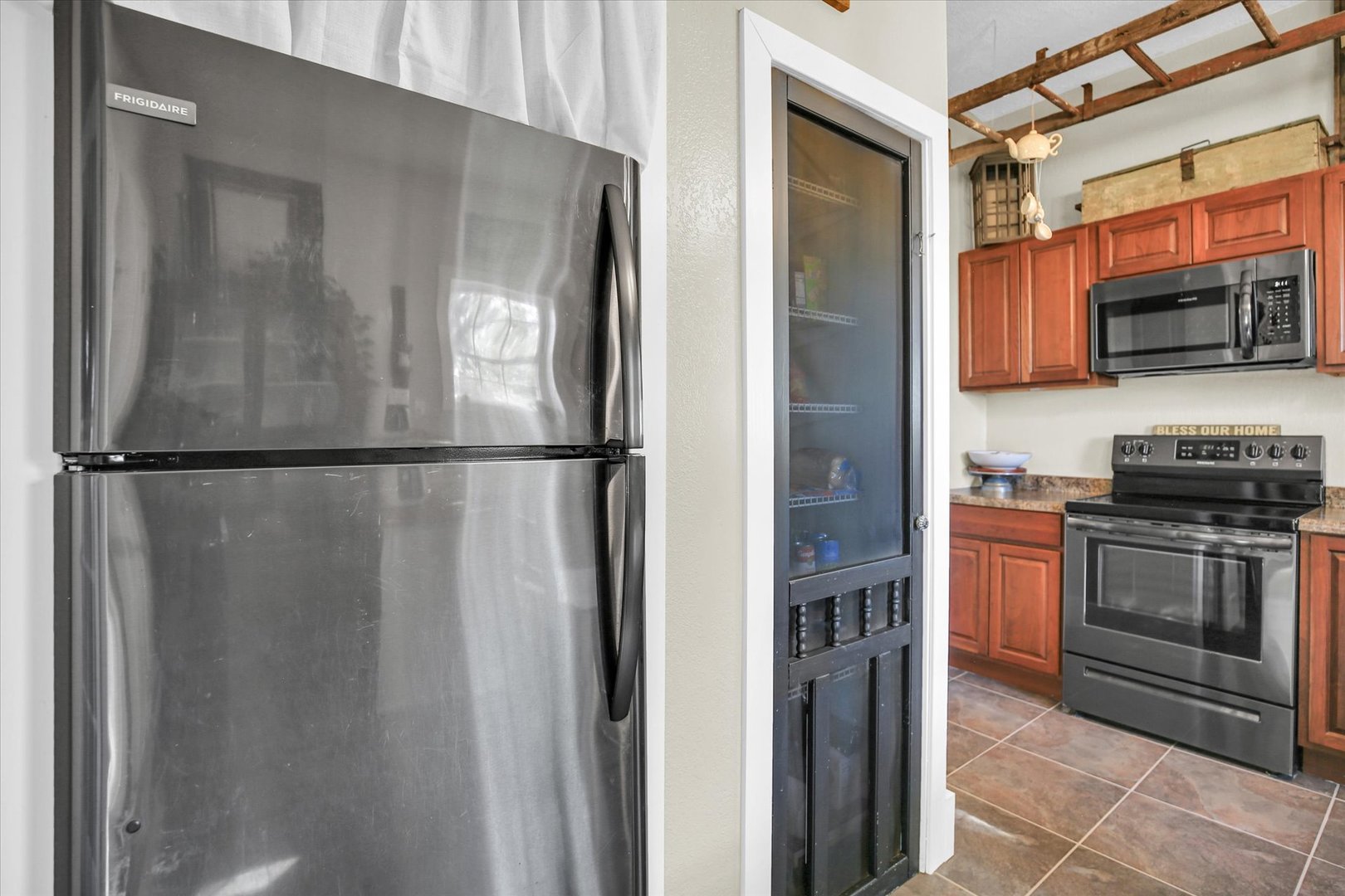 151 County 1700 Road East Villa Grove, IL 61956 - Photo 45 of 76 a kitchen with stainless steel appliances granite countertop a refrigerator and a stove top oven