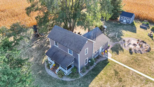 a view of a patio with a table and chairs and potted plants