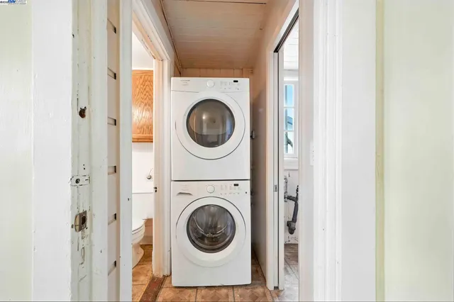 a view of a hallway with washer and dryer