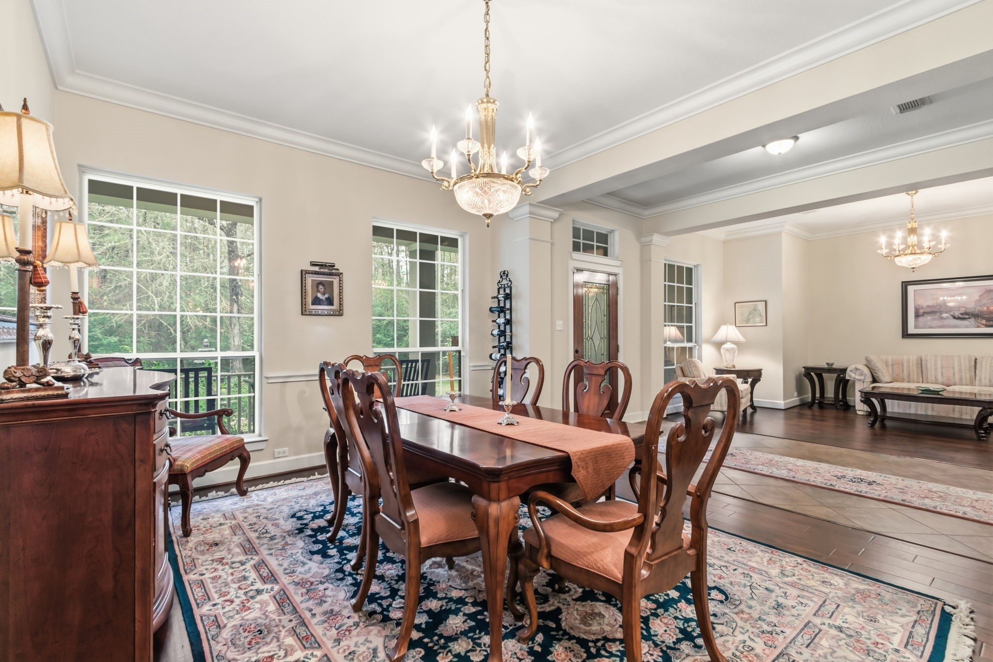7514 Saddle Blanket Drive Waller, TX 77484 - Photo 10 of 50 This well designed dining room features chair rail, crown molding, and engineered wood floors. Natural light streams in through two large windows. The chandelier is excluded from the sale.
