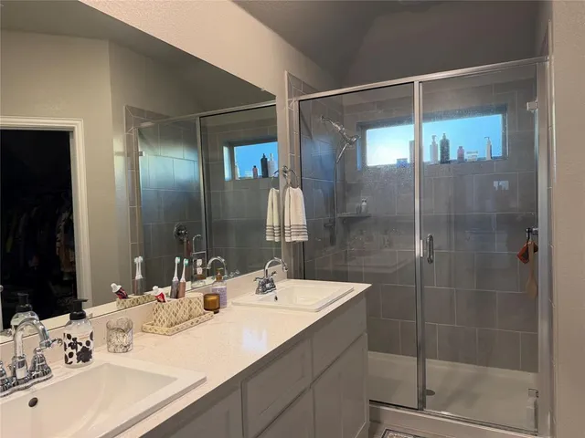 a bedroom with a bed and flat screen tv