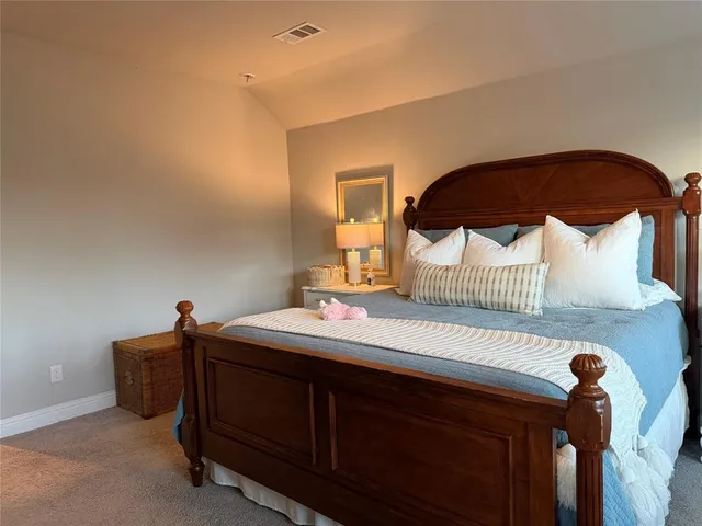 a bathroom with a shower sink and mirror
