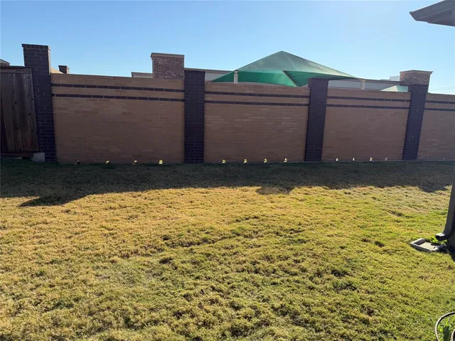 a view of a porch with dining table and chairs with wooden floor