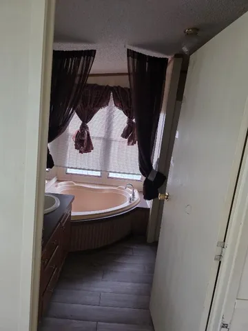 a bathroom with a sink and mirror