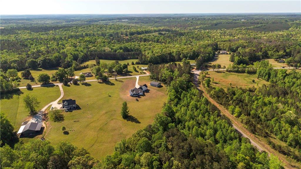 2392 Welcome Road Roopville, GA 30170 - Photo 12 of 65 an aerial view of residential houses with outdoor space