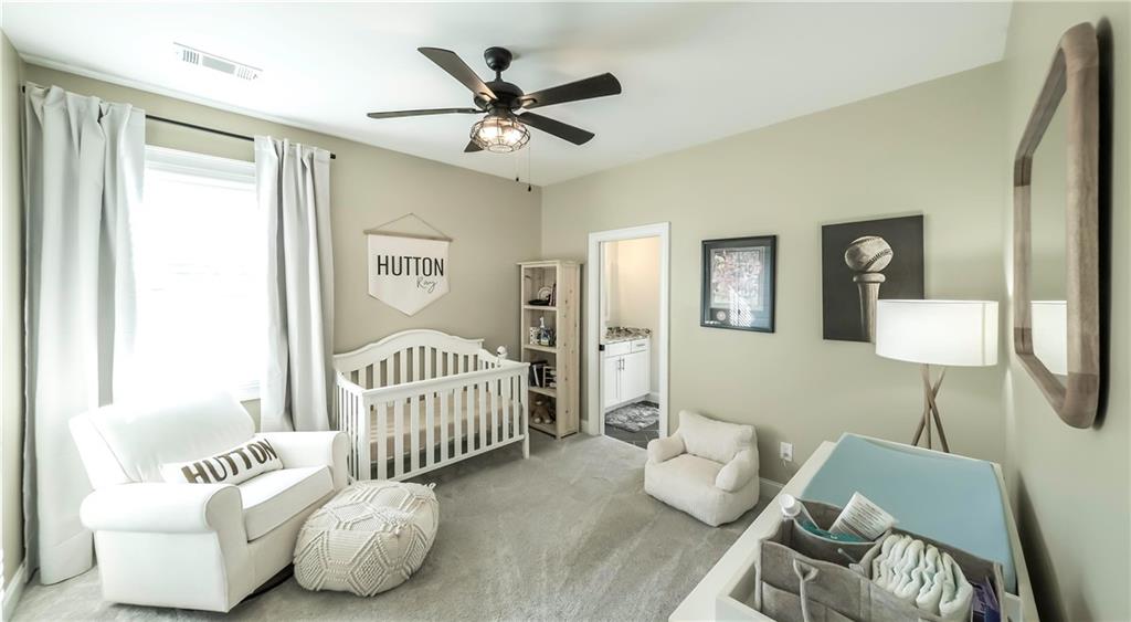 2392 Welcome Road Roopville, GA 30170 - Photo 22 of 65 a bedroom with furniture and a window