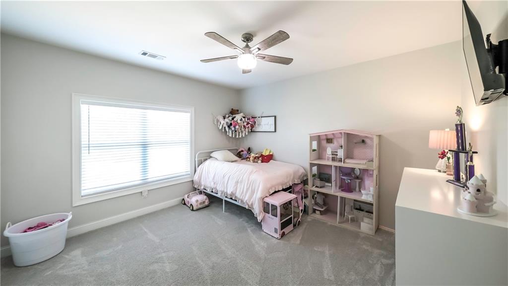 2392 Welcome Road Roopville, GA 30170 - Photo 30 of 65 a bed room with a bed and a window