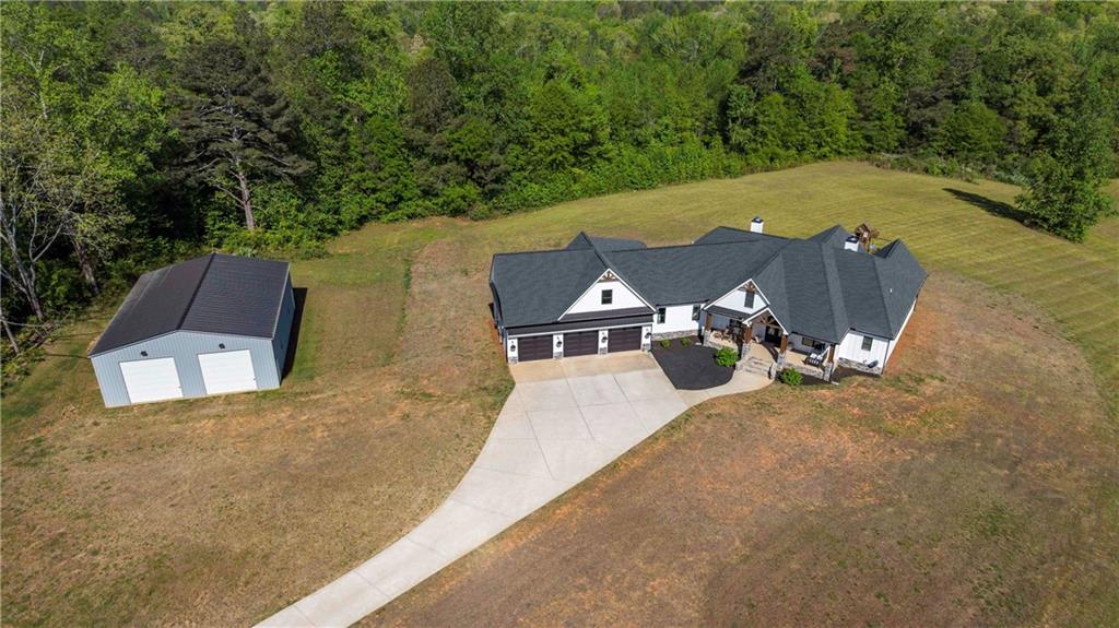 2392 Welcome Road Roopville, GA 30170 - Photo 3 of 65 an aerial view of a house with outdoor space pool seating area and entertaining space