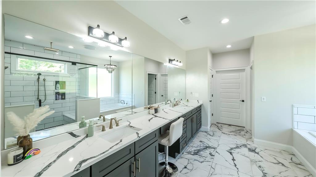 2392 Welcome Road Roopville, GA 30170 - Photo 57 of 65 a bathroom with a double vanity sink mirror and double